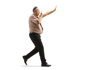 Security officer running with a walkie talkie