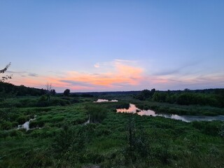 fantastic sunsets over the hills, meadows and forest