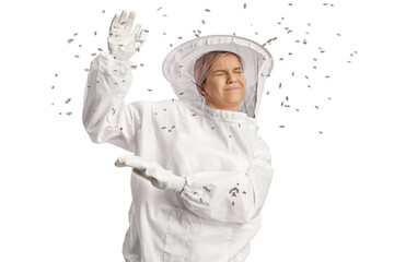 Bees attacking a young female bee keeper in a uniform