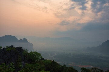 Sunrise over the smoged rice fields taken from Pha Ngern view point near Vang Vieng, Laos, Asia