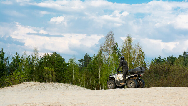 Atv freeriding in sand quarry, extreme sport