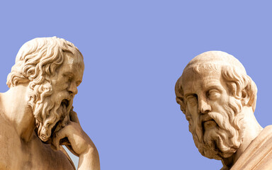 Plato and Socrates, the ancient Greek philosophers, with thoughtful expressions. Marble statues,...