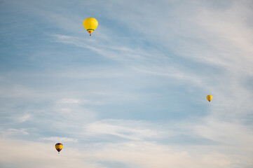 Colorful hot air balloons in blue sky