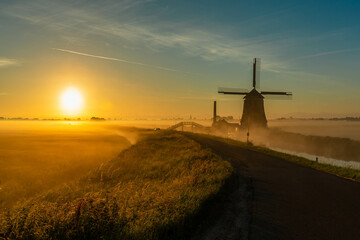 windmill in the fog - obrazy, fototapety, plakaty