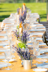 Lavander flower table decorations for holidays and wedding dinner. Wedding table decoration in rustic style with lavander