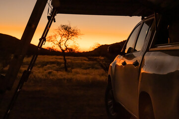 Car with roof tent camping in sunset in Namibia Africa © Andreas