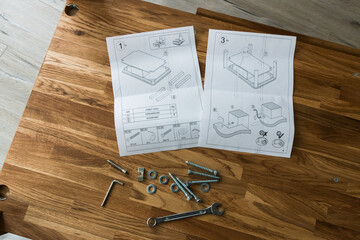 tools and instructions for assembling a wooden table
