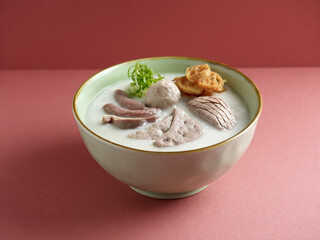 Mixed Pig Organ Congee served in a dish isolated on mat side view on grey background