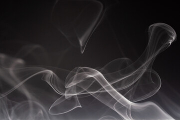 Abstract smoke on a dark background . Isolated .