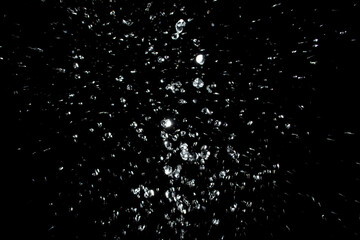 air bubbles in the water isolated on black background