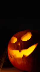 Halloween pumpkin smile with scary eyes for party night. Close up view of scary Halloween pumpkin...