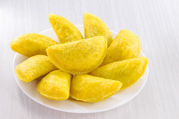 Colombian empanada, wheat flour pastry stuffed with meat and served with spicy sauce, typical of colombia, south america