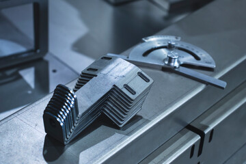 Metalworking parts on a bending machine, close-up