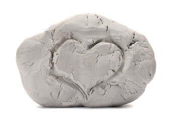 Grey modelling clay and heart engraved isolated on white  