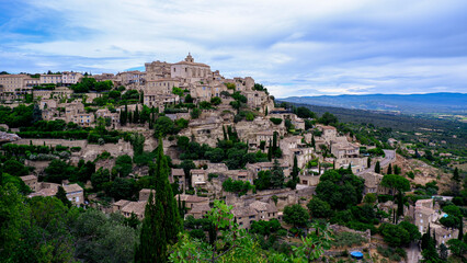 Beautiful city of Gordes perched atop a hillside in the Provence countryside of France