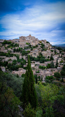 Fototapeta na wymiar Beautiful city of Gordes perched atop a hillside in the Provence countryside of France