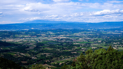Fototapeta na wymiar Villages dot the French countryside - Luberon region of Provence in the summer