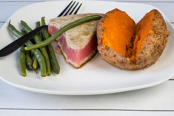 season tuna steak with sweet potato and green beans