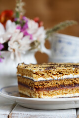 Homemade honey layer cake on the table.