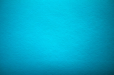 Blue texture of soft cardboard. Pure blue background. A clean place for a congratulatory text. Blue felt fabric background. High quality.