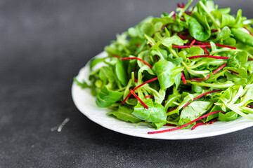 salad beet green leaves mix beetroot, mache leaves, cress fresh healthy meal food snack diet on the...