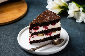 Chocolate cake with raspberry on plate. Slice of cake. Raspberry cake. Wedding dessert. Black forest cake. Delicious dessert. Traditional german dessert