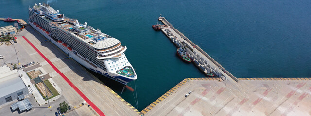 Aerial drone ultra wide photo with copy space of crowded cruise liner ship with pool facilities...