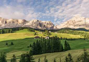 Beautiful day in the Italian Dolomites mountains with lakes and pastures. 
