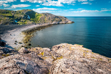 Fototapeta premium Summer tundra. Rocky coastline of Barents Sea near Teriberka, panoramic aerial view. Scenery of Russian North. Kola Peninsula, Murmansk Oblast, Russia