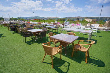 Sale of garden wicker furniture in outdoor store