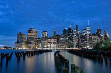 New York City Manhattan Skylinde water and cloud, city lights at night, view from East River