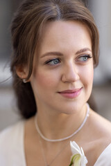 Bride holding white orchid flower