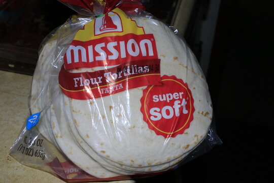 A closeup of mission flour Tortillas shells in a bag on a counter top in Hutchinson Kansas USA.