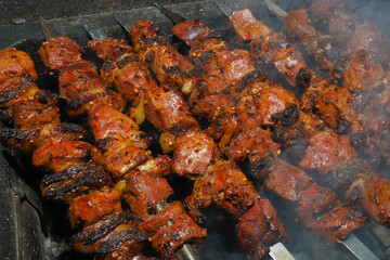 beef liver shish kebab on skewers is grilled on the grill 