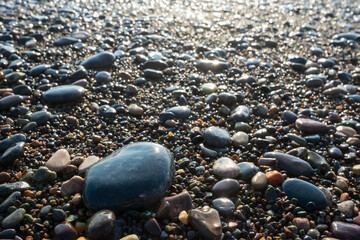Colored blue and yellow sea stones background. Top view