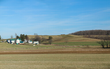 Fototapeta na wymiar Amish farm in the rolling countryside, farmland in Ohio's Amish country