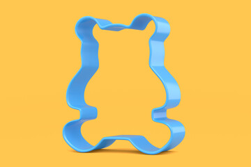 Metal cookie cutters for homemade Christmas biscuit on a yellow background.
