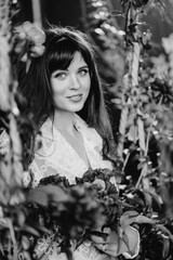 fabulous. a beautiful and gentle woman in peony flowers. black-and-white 