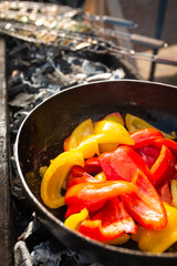 bulgarian pepper is fried on coals. Sweet red pepper on the grill.