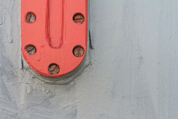 Industrial background - grunge metal texture, piece of machinery. Gray and red painted used metal. Old metal iron panel