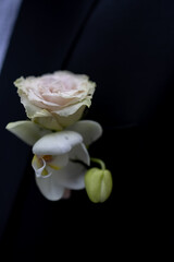 Wedding accessories of the bride: bouquet or boutonniere with delicate flowers. Boutonniere groom. the bride's bouquet 