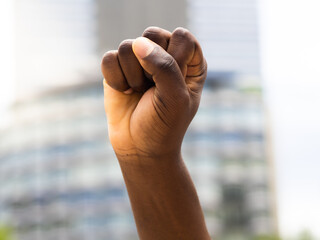 Close-up of a raised fist of an African person at a demonstration against racism.Black Lives Matters