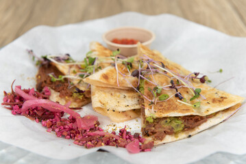 Nutritious cheese quesadilla with BBQ jerk jackfruit on a tortilla will start any day with a nutrional boost