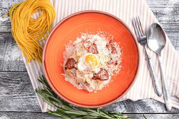 Carbonara paste, carbonara on a white wooden background, top view