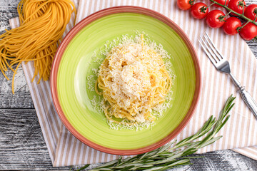 Pasta with cheese, pasta on a white wooden background, top view