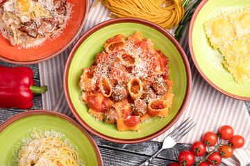Pasta, different types of pasta on a white wooden background, top view