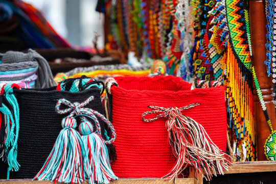 Street sale of hand made traditional Colombian mochilas and necklaces at Caldas Square in the center of the city of Popayan