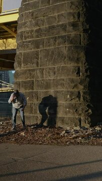 A vertical video, seamless looping flinger flick clip. Available in both horizontal and vertical video. Shot in downtown Pittsburgh, Pennsylvania.  	