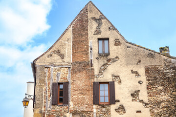 Facade of old houses, medieval buildings, in a typical french medieval village and city, bergerac,...