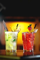 tropical drinks made in a Brazilian restaurant, caipirinha and caipirosca with strawberry, lemon, passion fruit and pineapple